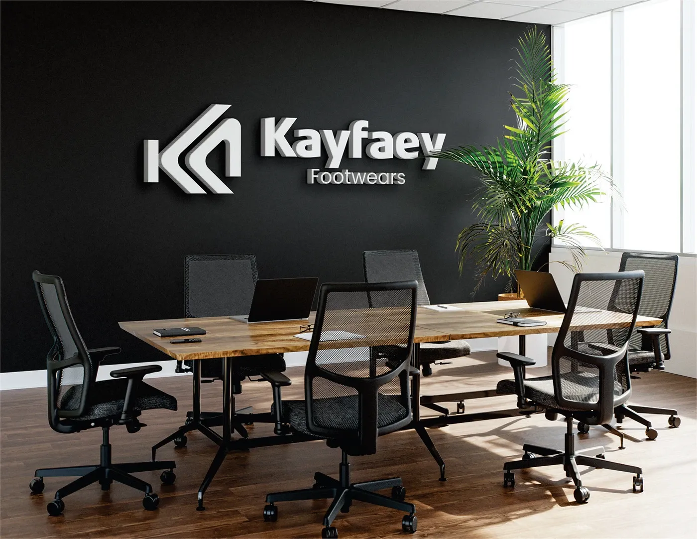The logo mounted as signage on a dark office meeting room wall