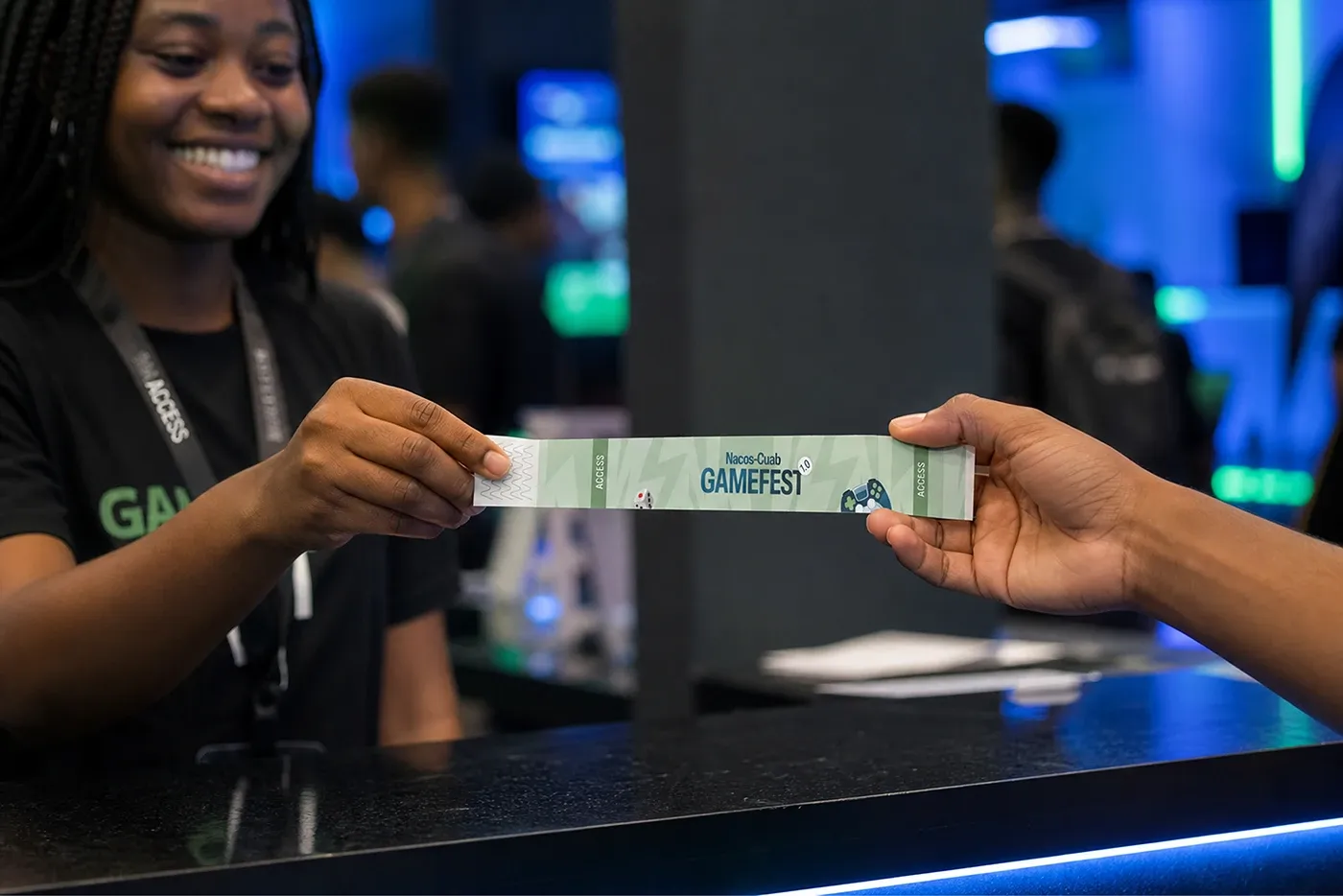 A ticket being handed across a counter at the event