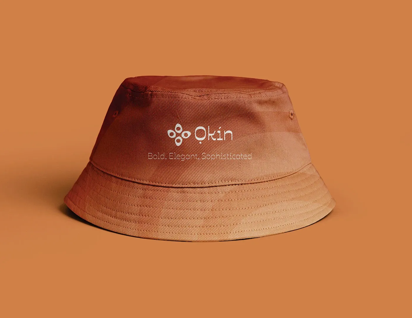 A branded bucket hat in terracotta