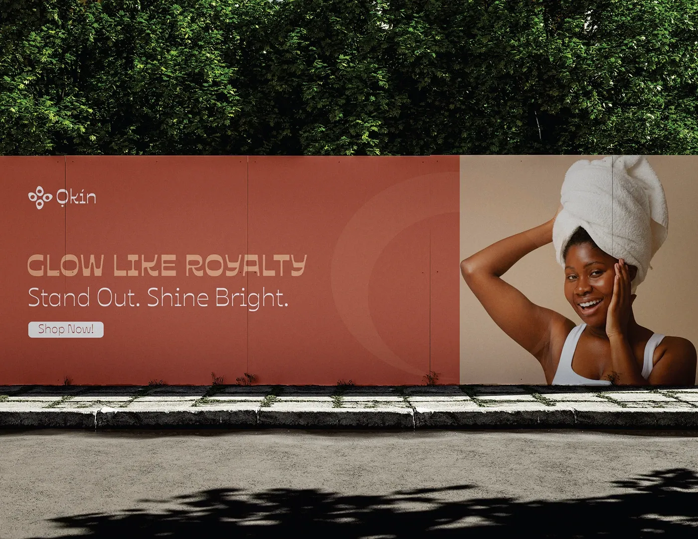 A roadside billboard reading Glow Like Royalty, Stand Out Shine Bright
