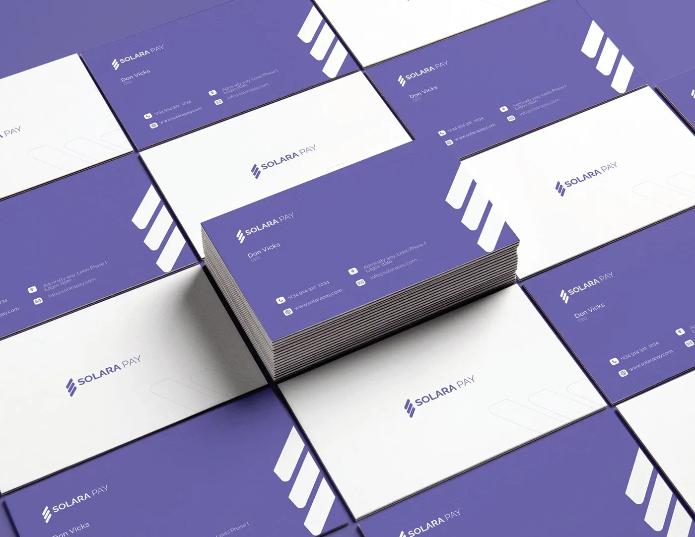 Business cards laid out in a grid, purple and white